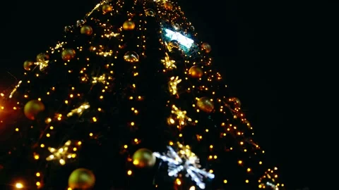 Frame in motion, against the background the night city, fir tree decorated with Stock Footage 145198731