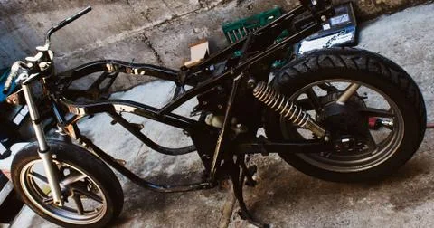 Frame of the motorcycle in the workshop tools kit Stock Photos
