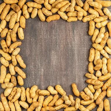 Frame of the peanuts with the shell top view Stock Photos