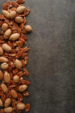 Frame of pecan nuts on marble background. Stock Photos