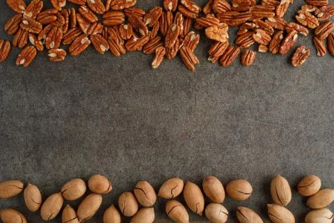 Frame of pecan nuts on marble background. Stock Photos