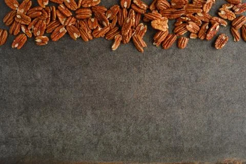 Frame of pecan nuts on marble background. Stock Photos