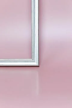 Frame on a pink background. Frame in the interior. Stock Photos