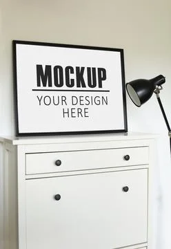 Frame, poster mock up with black horizontal frame. Empty frame standing on th Stock Photos