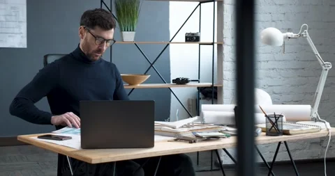 The frame of a professional Designer is working in a big modern Office. Elegant Video stock 155640432