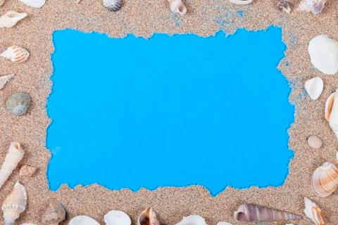 Frame of shells and sand on blue Stock Photos