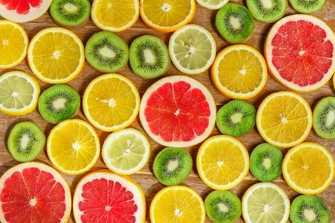 Frame with slice of oranges, lemons, kiwi, grapefruit pattern isolated on w.. Stock Photos