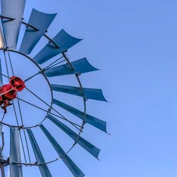 Frame Square Close up of the multiple blades of a windpump with clear blue sky Stock Photos