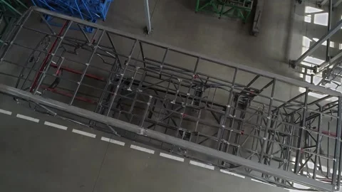 The frame structure of the bus in the assembly shop of the plant. Stock Footage 255725467