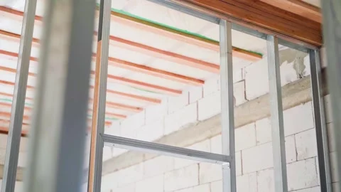 Frame structure made of metal profile for plasterboard sheathing in a room with Stock Footage 243059136