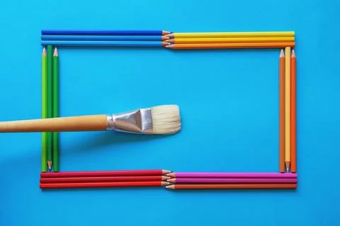 Frame for text or image made of bright colored pencils. Paint brush Stock Photos