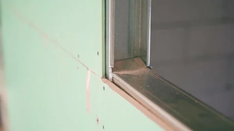 The frame from the U profile is sheathed with drywall close-up. Frame partition Stock Footage 236921470