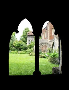 Frame within a frame of arched windows with green grass Stock Photos