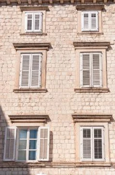 Framed ancient windows with shutters Stock Photos