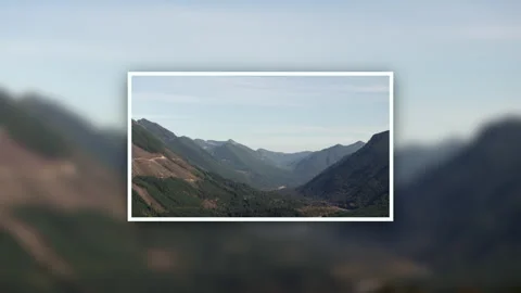 Framed Mountain Valley View with Layered Peaks Stock Footage 294739266
