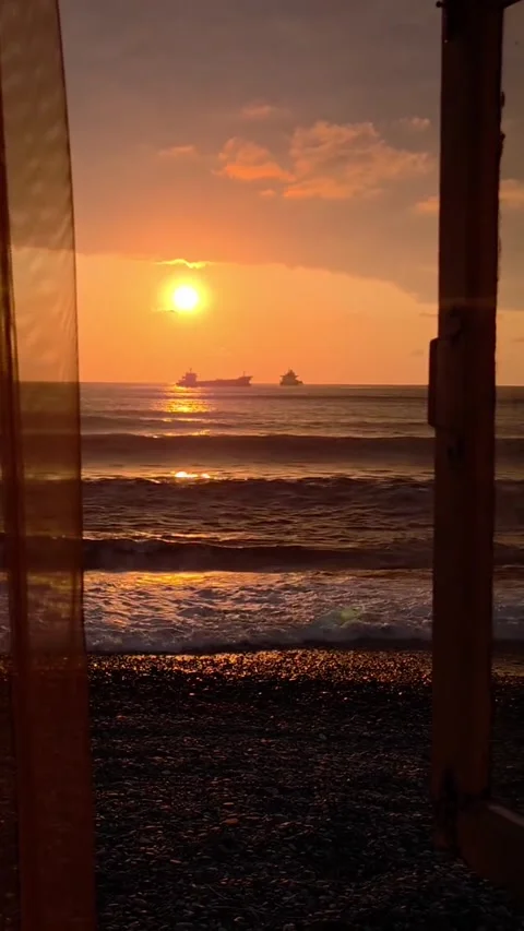 Framed Ocean Sunset View with Cargo Ships 库存影片 341630095