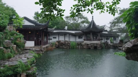Framed Rainy View of Suzhou Classical Garden, Pavilion and Pond with Rockery Stock Footage 345224726