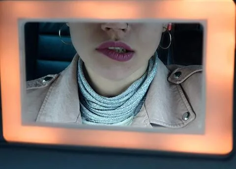 Framed Reflection of a Woman’s Lips and Outfit 스톡 사진