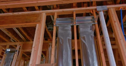 Framed residential home with basic rough plumbing completed on new construction Video stock 171035505