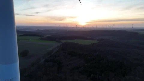 Framed tower edge with blade motion at sunset Stock Footage 331213960