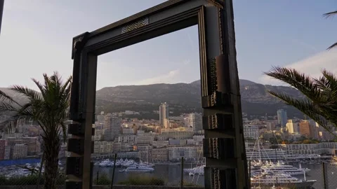 Framed view of Monaco cityscape with mountains and harbor in 4K Stock Footage 316036636