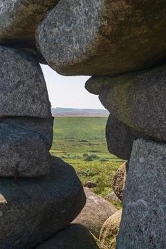 Framed view through rock formation rocks on Bodmin Moor landscape behind Stock Photos