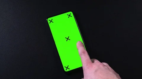 Frameless smartphone with green screen in hand, swipe gestures Video stock 124659665