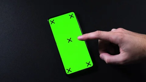 Frameless smartphone with green screen in hand, swipe gestures Video stock 124659722