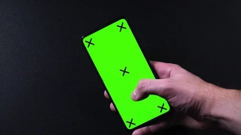 Frameless smartphone with green screen in hand, swipe gestures Video stock 124659723