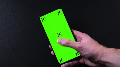 Frameless smartphone with green screen in hand, swipe gestures Video stock 124659739