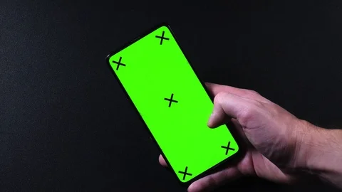 Frameless smartphone with green screen in hand, swipe gestures Video stock 124659746