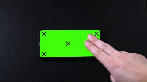 Frameless smartphone with green screen in hand, swipe gestures Video stock 124659763