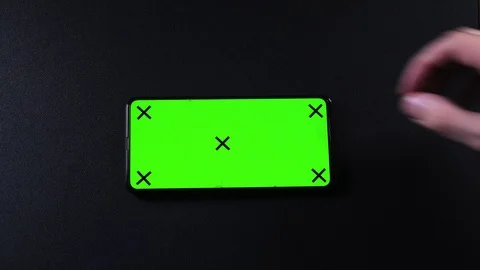 Frameless smartphone with green screen in hand, swipe gestures Stock Footage 124659765