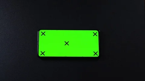 Frameless smartphone with green screen in hand, swipe gestures Video stock 124659802