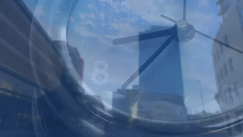 Frames advancing semi-transparent clock over city, moving hands, indicating time Stock Footage 330330975