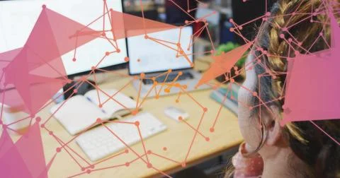 Frames advancing, woman focusing at tech desk, animated nodes layering screens Stock Photos