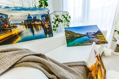 Frames collage with floral posters on bricks textured wall, over modern couch Stock-Fotos