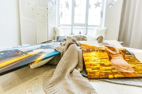 Frames collage with floral posters on bricks textured wall, over modern couch Stock-Fotos