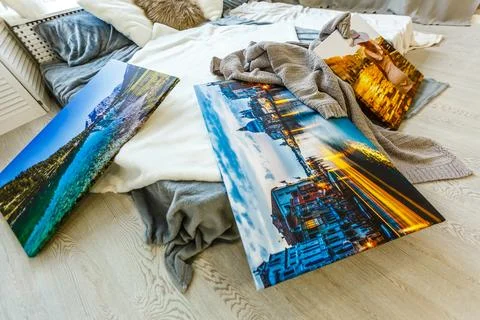 Frames collage with floral posters on bricks textured wall, over modern couch Stock-Fotos