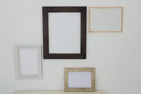 Frames hanging on wall Stock Photos