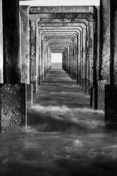 Frames of pillars under the pier Stock Photos