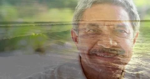 Frames starting crossfade, senior man holding pose while ocean blending face, Video stock 331047873