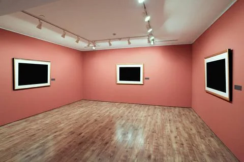 Frames on the wall in exhibition room blank picture frame in a room agains... Stock Photos