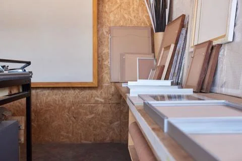 Frames on a workbench in picture framing studio Stock Photos