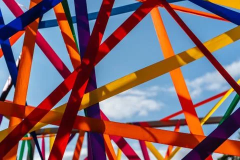 Framework of multi-colored ribbons against the blue sky close-up Foto stock