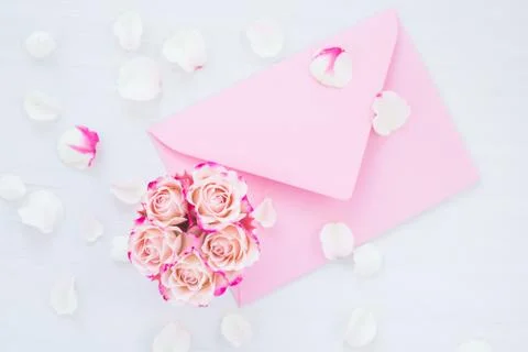 Framework of pink roses and gifts. Spring concept, flat lay, copy space Stock Photos