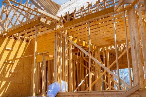 Framing beams at wooden framework construction of new house under construction a Stock Photos