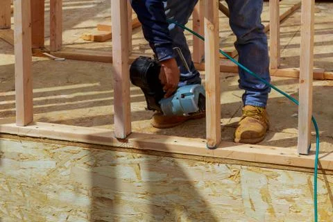 Framing building contractor framing up wall section for a luxury custom house Stock Photos