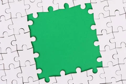 Framing in the form of a rectangle, made of a white jigsaw puzzle around the  Foto stock
