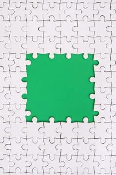 Framing in the form of a rectangle, made of a white jigsaw puzzle around the  Stock Photos